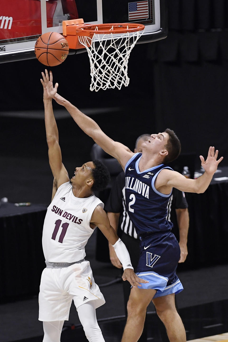 Arizona State's Alonzo Verge Jr., left, shoots as Villanova's Collin Gillespie defends in the first half of an NCAA college basketball game, Thursday, Nov. 26, 2020, in Uncasville, Conn. (AP Photo/Jessica Hill)