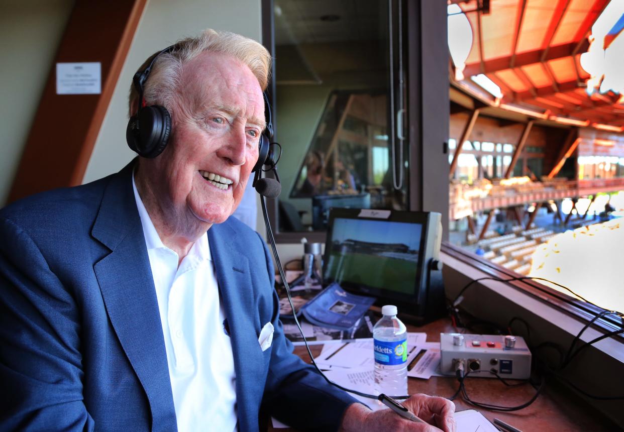 Legendary broadcaster Vin Scully sits in the booth at the Los Angeles Dodgers' Camelback Ranch Spring Training complex in Glendale, Arizona on March 25, 2016, during his last broadcast there.