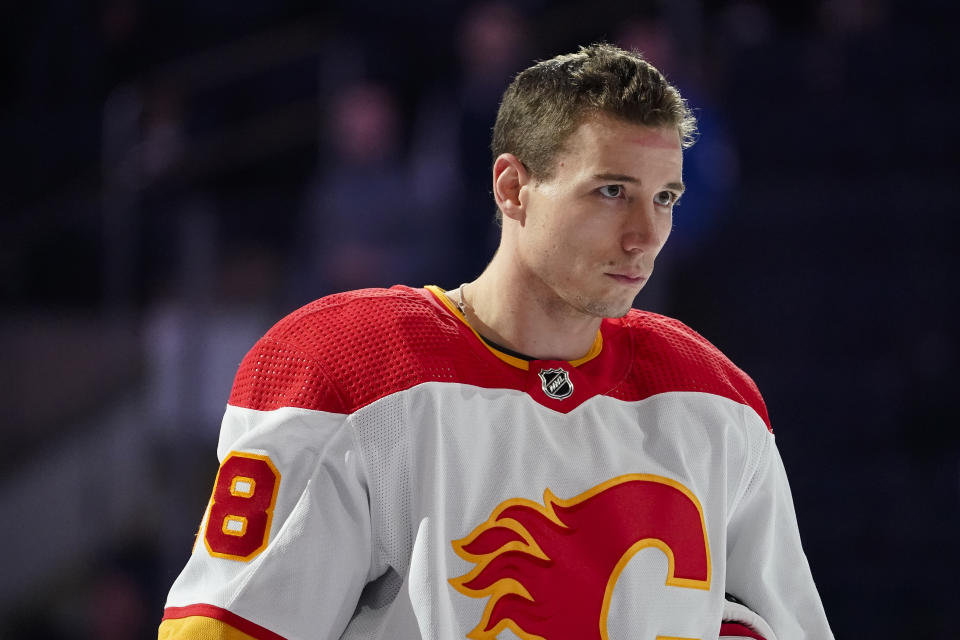 FILE - Calgary Flames left wing Andrew Mangiapane stands for the Canadian national anthem during the first period of an NHL hockey game against the New York Rangers, Monday, Oct. 25, 2021, in New York. After sitting through 12-plus rounds of the NHL draft over the span of two consecutive summers, Andrew Mangiapane had all but given up on ever hearing his name called. (AP Photo/John Minchillo, File)