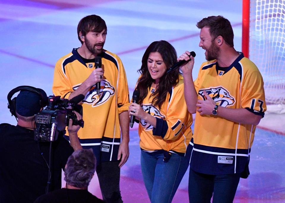 Lady A sings the National Anthem before game 6 of the second round NHL Stanley Cup Playoffs at the Bridgestone Arena Sunday, May 7, 2017, in Nashville, Tenn.