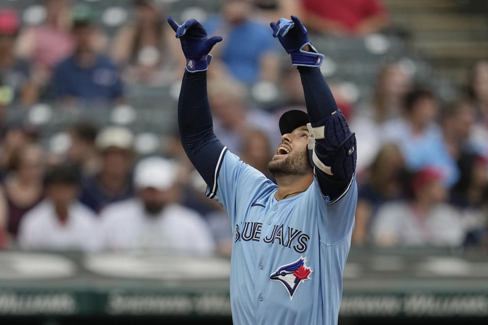Toronto Blue Jays' George Springer gestures as he crosses the plate on a home run against the Cleveland Guardians during the first inning of a baseball game Wednesday, Aug. 9, 2023, in Cleveland. (AP Photo/Sue Ogrocki)