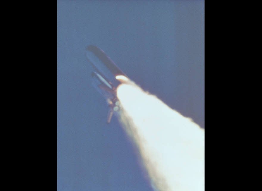 This 70mm still photograph of the 51-L launch was taken from Camera Pad 10 north of Launch complex 39-B approximately 58.32 seconds after launch. The photograph shows an unusual plume in the lower part of the right hand solid rocket booster (SRB) (026); Photograph of the 51-L launch at approximately 58.82 seconds after launch shows an unusual plume in the lower part of the right hand SRB (027); Photograph of the 51-L launch at approximately 1 minute, 13.14 seconds after launch showing a plume in the lower part of the right hand SRB (028). (NASA)