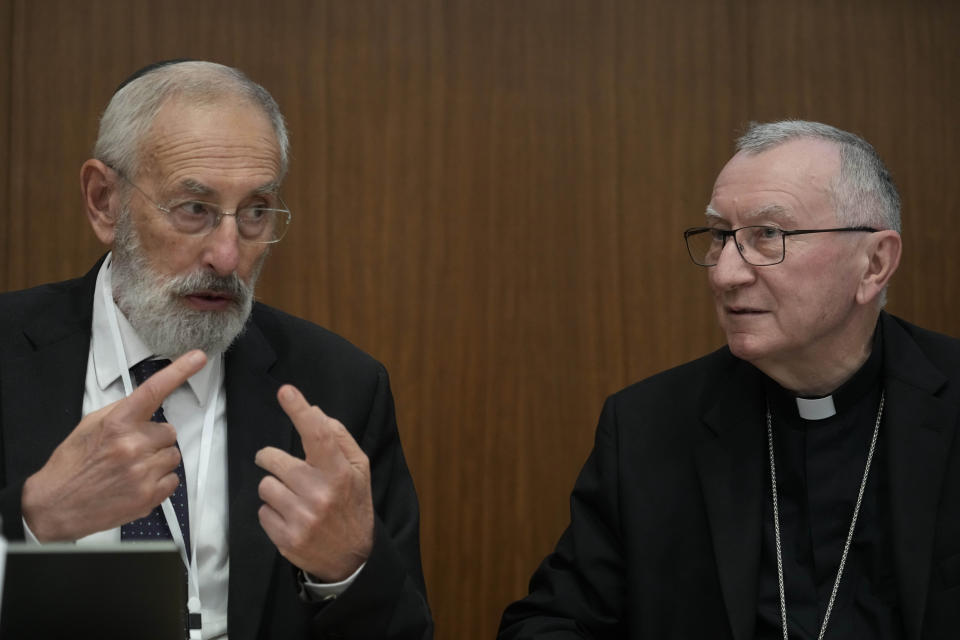 Rome's Chief Rabbi Riccardo Di Segni, left, talks to Vatican Secretary of State Pietro Parolin during the international conference "New documents from the Pontificate of Pope Pius XII and their Meaning for Jewish-Christian Relations: A Dialogue Between Historians and Theologians", at the Gregorian University in Rome, Monday, Oct. 9, 2023. (AP Photo/Gregorio Borgia)