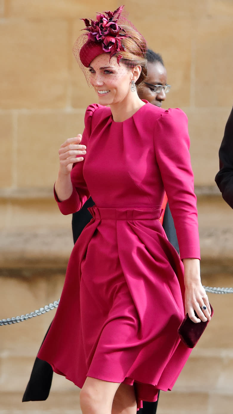 Kate Middleton wearing a magenta dress at Princess Eugenie’s wedding. [Photo: Getty]