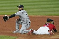 Chicago White Sox's Nick Madrigal, left, can't hold onto the ball as Cleveland Indians' Jose Ramirez steals to second base in the third inning in a baseball game, Tuesday, April 20, 2021, in Cleveland. (AP Photo/Tony Dejak)