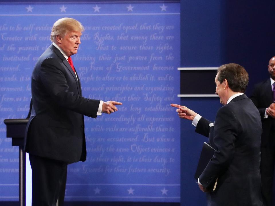 Donald Trump gestures to Fox News anchor and moderator Chris Wallace after the third U.S. presidential debate at the Thomas & Mack Center on October 19, 2016