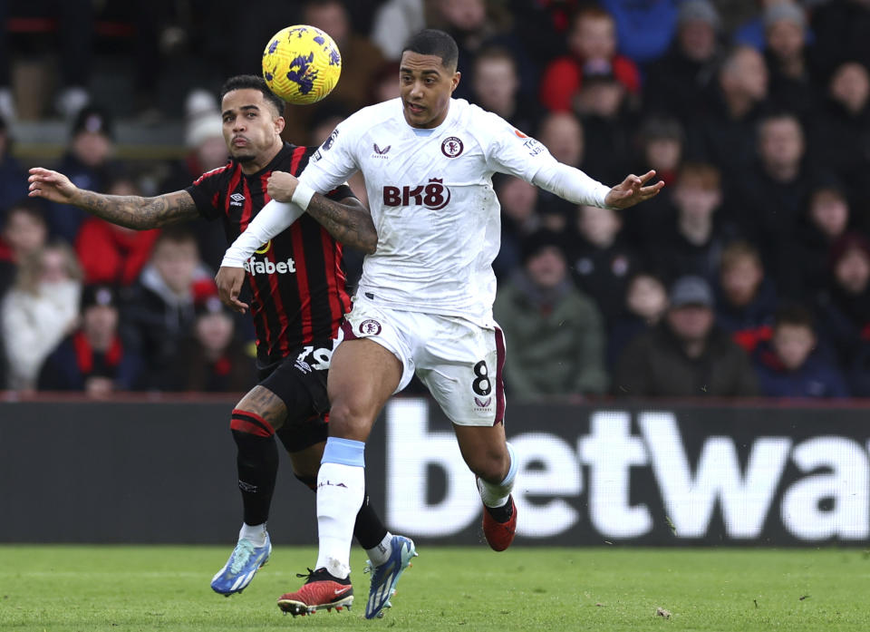 Bournemouth's Justin Kluivert, left and Aston Villa's Youri Tielemans vie for the ball, during the English Premier League soccer match between Bournemouth and Aston Villa, at the Vitality Stadium, in Bournemouth, England, Sunday, Dec. 3, 2023. (Steven Paston/PA via AP)