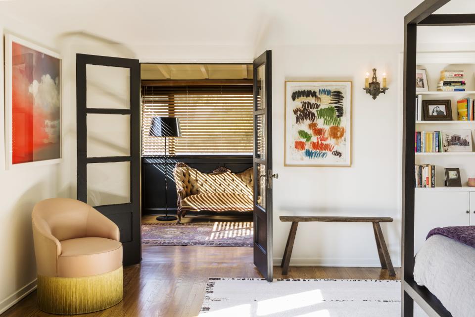 Also in the bedroom, artwork hanging over the bench is <em>Aller Retour</em> (2008) by Günther Förg. The skirted club chair is by <a rel="nofollow noopener" href="https://www.thefutureperfect.com/dimore-studio-poltroncina-068.html" target="_blank" data-ylk="slk:Dimore Studio;elm:context_link;itc:0;sec:content-canvas" class="link ">Dimore Studio</a>.