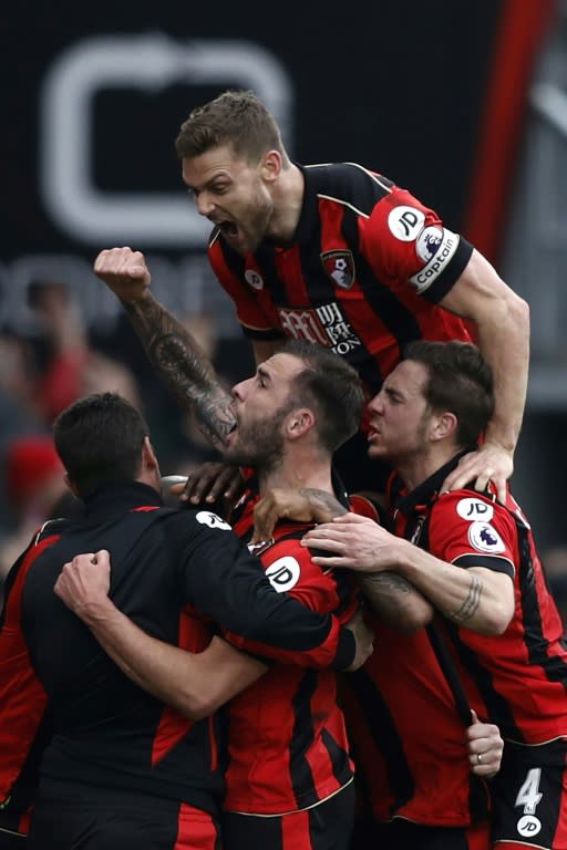 Bournemouth players celebrate on the touchline with manager Eddie Howe after Joshua King scores his third goal to give Bournemouth a 3-2 against West Ham on March 11, 2017