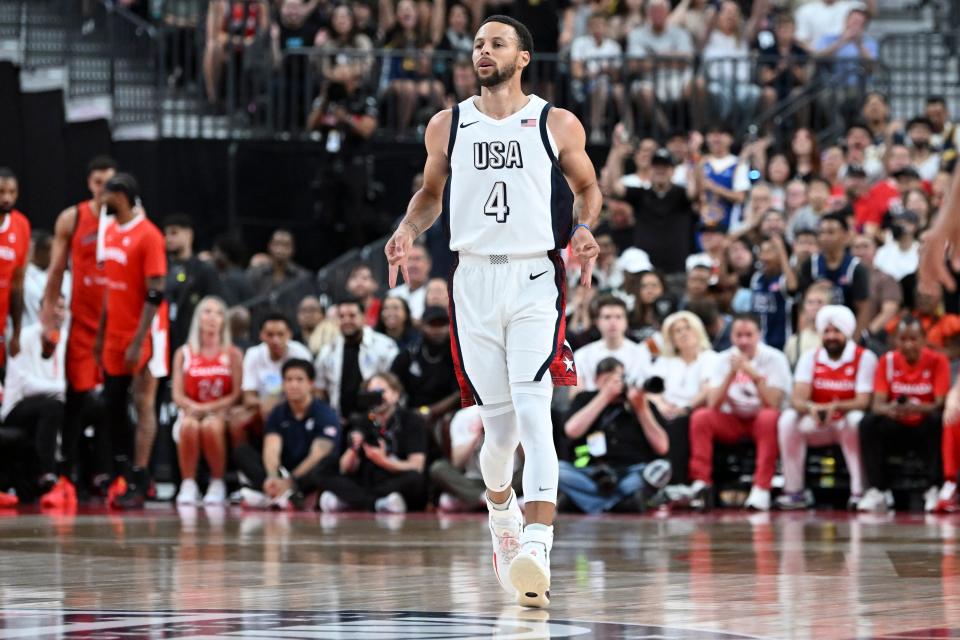 Steph Curry celebrates after scoring against Canada.