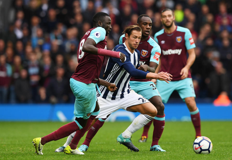 Cheikhou Kouyate of West Ham United and Michail Antonio of West Ham United battle for possession with Grzegorz Krychowiak of West Bromwich Albion during the Premier League match between West Bromwich Albion and West Ham United at The Hawthorns