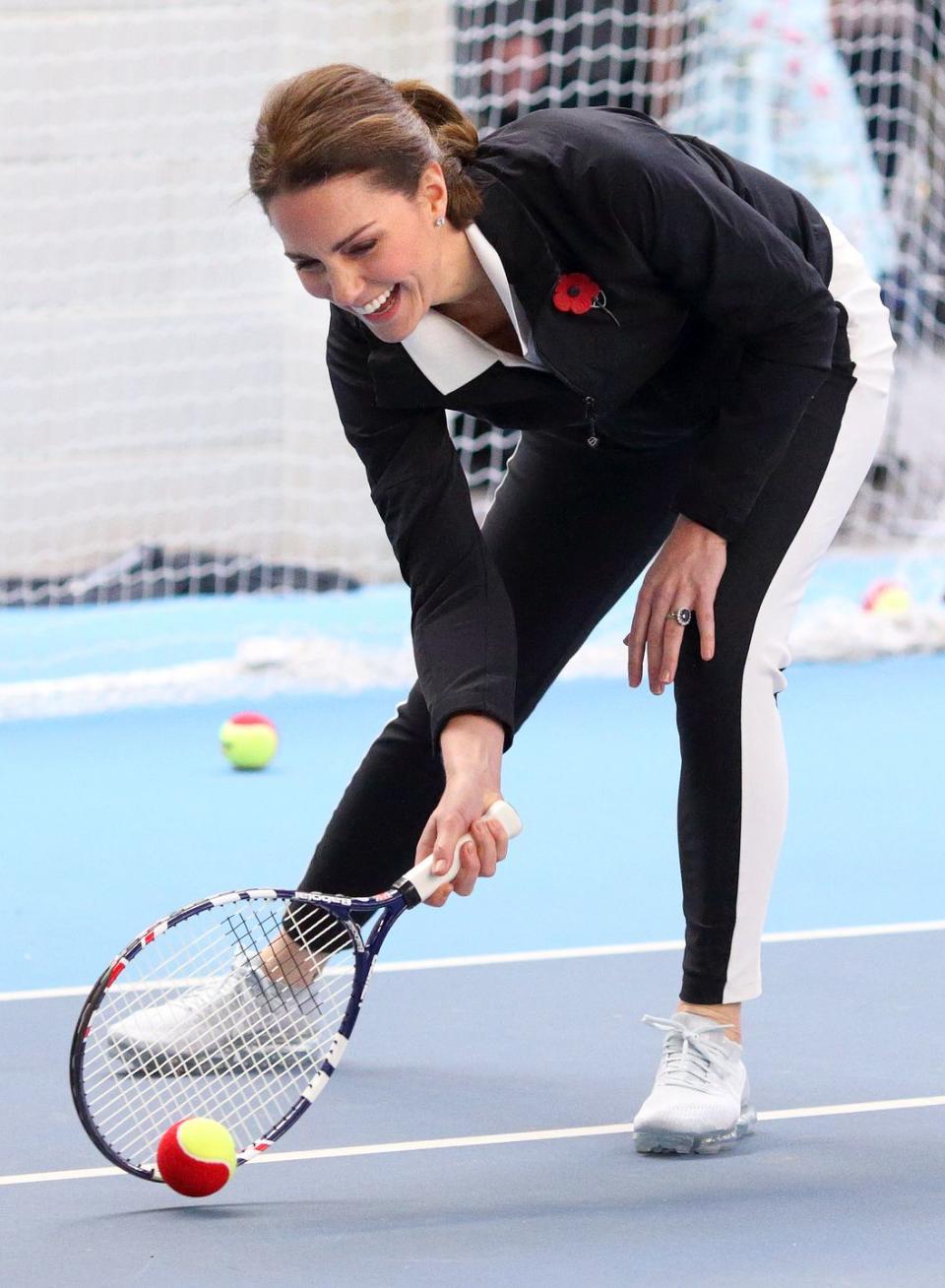 <p>While rallying at the National Tennis Centre, Kate sported a chic black and white look. </p>