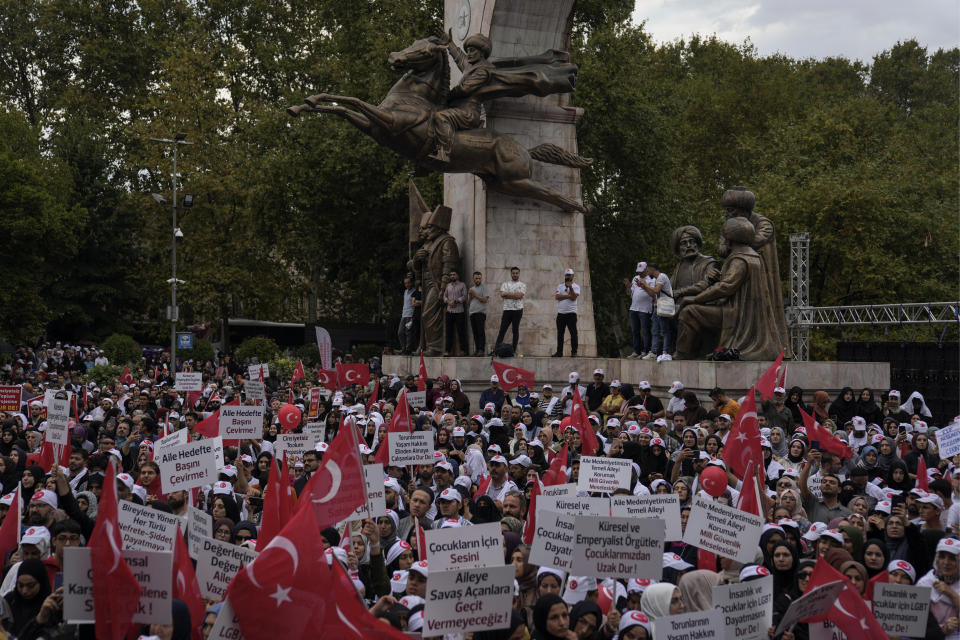 Turkish demonstrators holding Turkish flags attend a anti LGBTI+ protest in Fatih district of Istanbul, Sunday, Sept. 18, 2022. (AP Photo/Khalil Hamra)