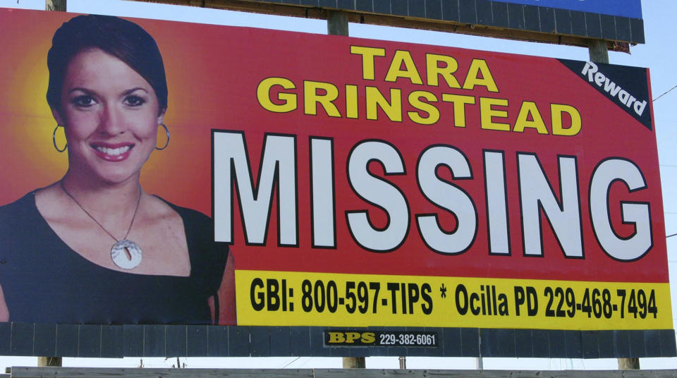 FILE - In this Wednesday, Oct. 4, 2006 file photo, missing teacher Tara Grinstead is displayed on a billboard in Ocilla, Ga. A Georgia man is standing trial on charges that he helped conceal the death of Tara Grinstead, who disappeared more than 13 years ago. Bo Dukes is charged with concealing a death, hindering the apprehension of a felon and lying to police after Tara Grinstead vanished from her home in rural Irwin County in October 2005. His trial began Monday, March 18, 2019. (AP Photo/Elliott Minor, File)