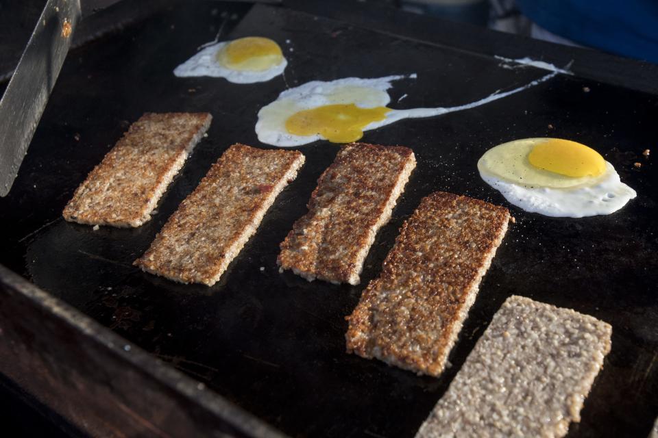 Goetta and eggs getting griddle fried at the Cincinnati Grill booth during Glier's Goettafest at Festival Park.
