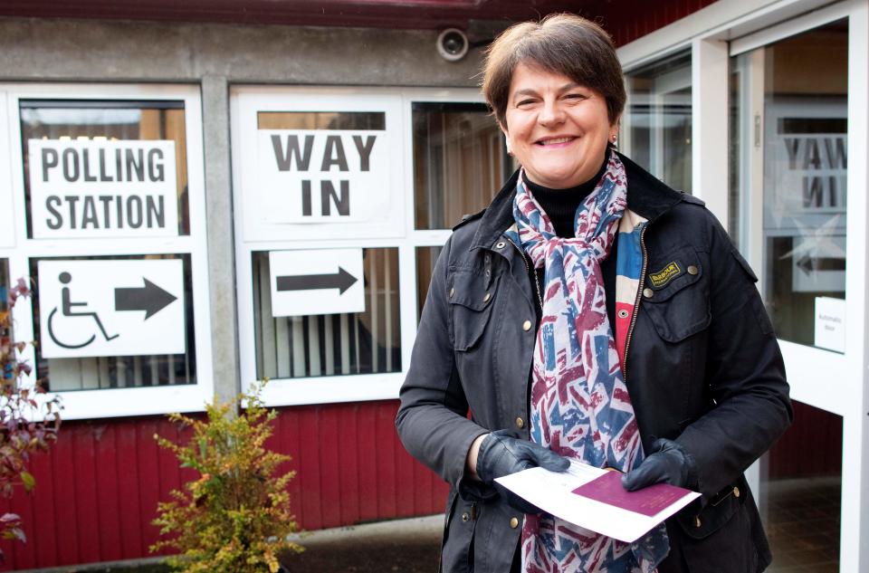 Northern Ireland's Democratic Unionist Party (DUP) leader Arlene Foster wears a Union flag-themed scarff as she arrives at a Polling Station to cast her ballot paper and vote in Brookeborough, Northern Ireland, on December 12, 2019, as Britain holds a general election. (Photo by Paul Faith / AFP) (Photo by PAUL FAITH/AFP via Getty Images)