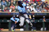 Tampa Bay Rays' Yandy Diaz hits a two-run double during the second inning of a baseball game against the Minnesota Twins, Wednesday, Sept. 13, 2023, in Minneapolis. (AP Photo/Abbie Parr)