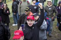 <p>A participant of an Alt-Right organized free speech event holds his fist up on the Boston Common on Nov. 18, 2017, in Boston, Mass. (Photo: Scott Eisen/Getty Images) </p>