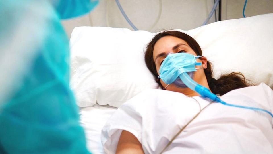 Woman in hospital bed