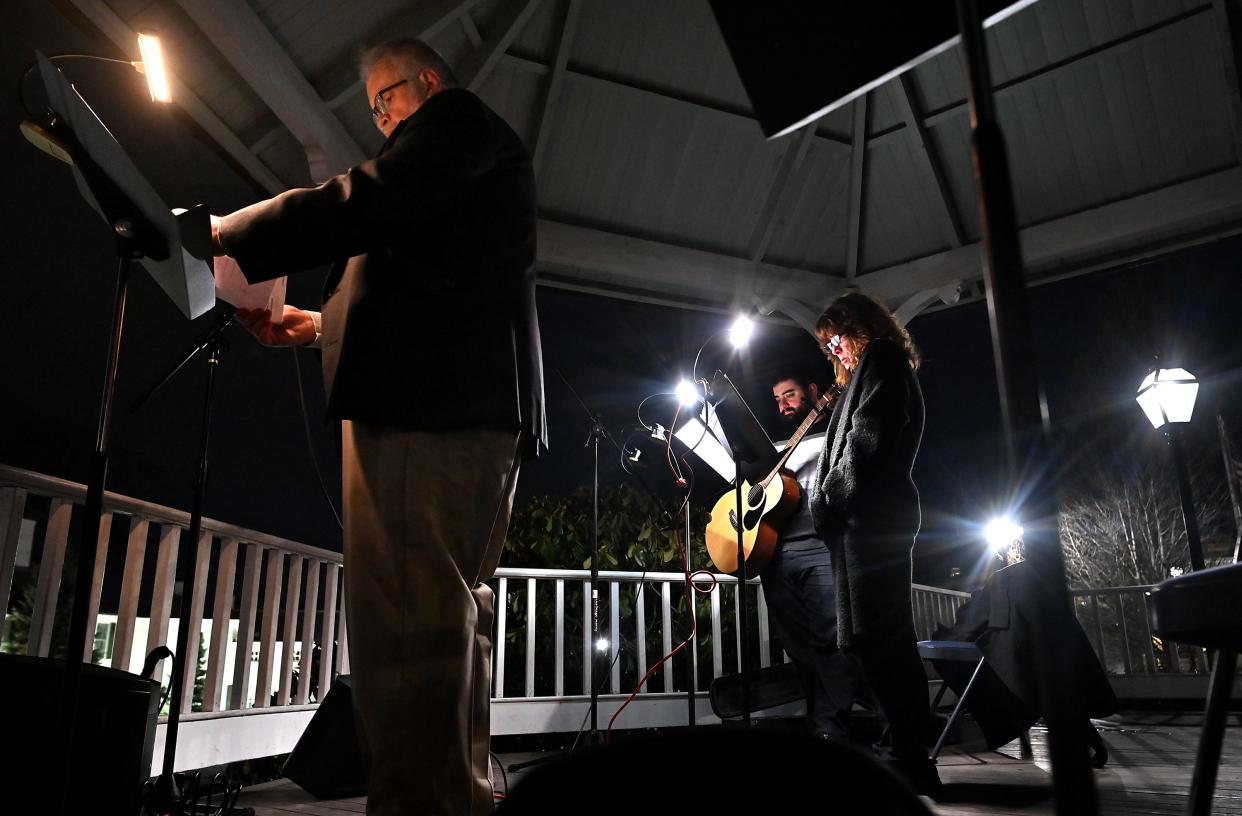 Organizer Ed Reardon speaks about Eileen Ferro on the Town Common. Standing by are musicians Lynne Canavan and Chrstopher Weigel.