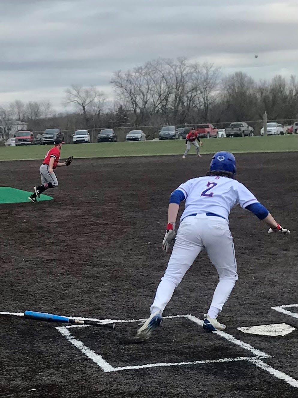 Highland's Cooper Mercking puts the ball in play during a home baseball game earlier this season against Marion Harding.