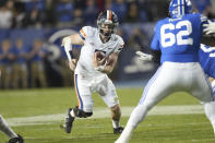 Virginia quarterback Brennan Armstrong (5) scrambles as BYU defensive lineman Atunaisa Mahe (62) is blocked during the first half of an NCAA college football game Saturday, Oct. 30, 2021, in Provo, Utah. (AP Photo/George Frey)