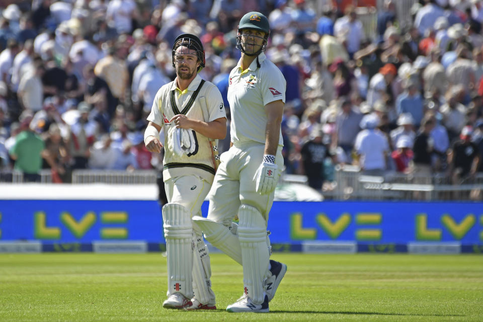 Australia's Travis Head, left, and Mitchell Marsh leave the field for tea break during the first day of the fourth Ashes cricket Test match between England and Australia at Old Trafford in Manchester, England, Wednesday, July 19, 2023. (AP Photo/Rui Vieira)