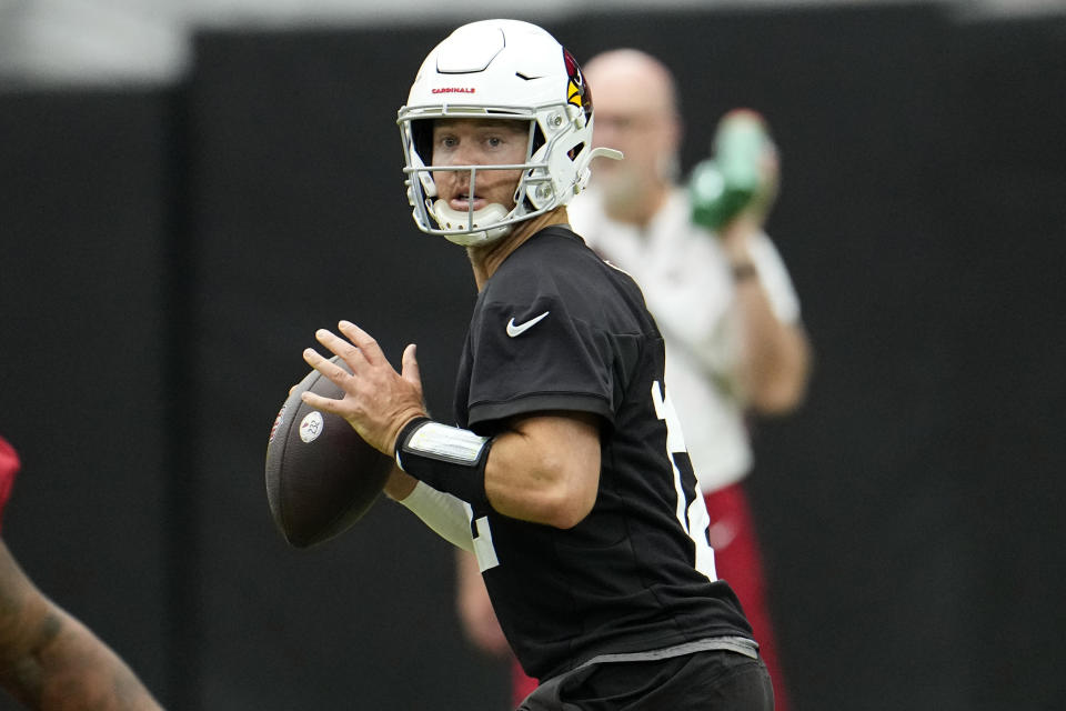 Arizona Cardinals quarterback Colt McCoy looks to pass the ball during NFL football training camp practice at State Farm Stadium Saturday, July 29, 2023, in Glendale, Ariz. (AP Photo/Ross D. Franklin)