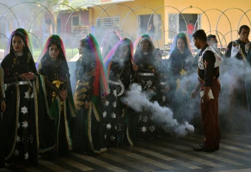 A group of Vale do Amanecer "nymphs" receive a blessing with incense