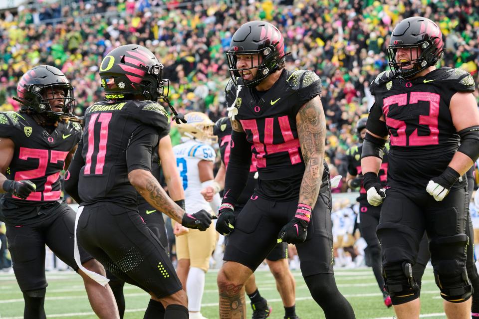 Oregon tight end Cam McCormick (84) celebrates with his teammates after scoring a touchdown during the second half against UCLA at Autzen Stadium in Eugene, Oregon on Oct. 22, 2022. The Ducks won the game 45-30.