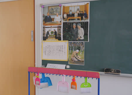 Pictures of the Japanese imperial family are displayed on a blackboard in a classroom at Tsukamoto kindergarten in Osaka, Japan, November 30, 2016. REUTERS/Ha Kwiyeon