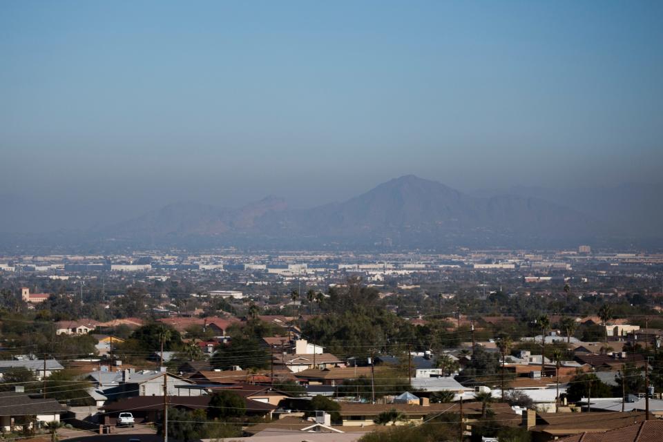 Air pollution is seen over a hazy Camelback Mountain on Jan. 2, 2020, in Phoenix, Ariz. 