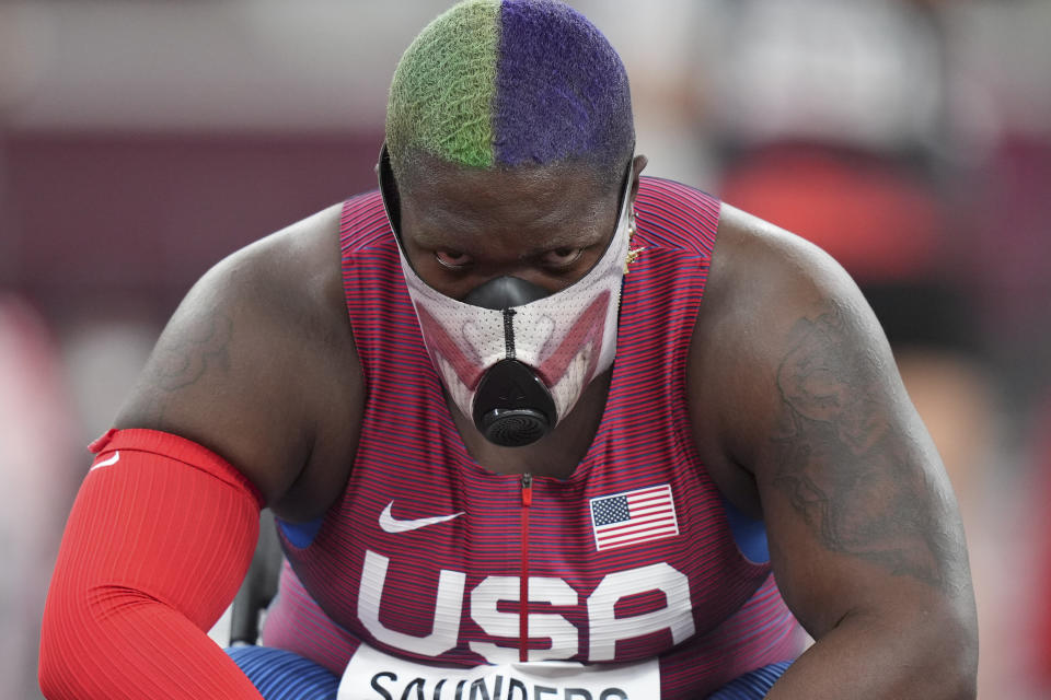 Raven Saunders, of United States, rests during throws of the qualification rounds of the women's shot put at the 2020 Summer Olympics, Friday, July 30, 2021, in Tokyo. (AP Photo/Matthias Schrader)