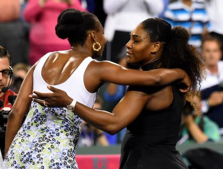 Mar 12, 2018; Indian Wells, CA, USA; Venus Williams (USA) and Serena Williams (USA) hug after their third round match in the BNP Paribas Open at the Indian Wells Tennis Garden. Venus Williams won the match. Mandatory Credit: Jayne Kamin-Oncea-USA TODAY Sports