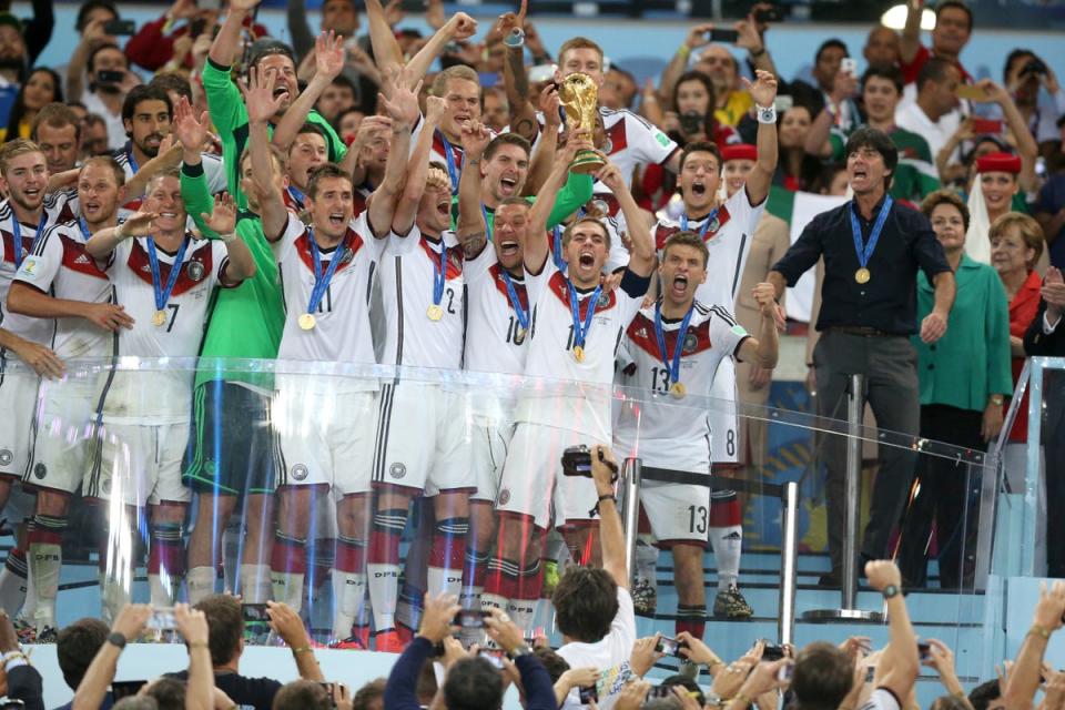 Joachim Low (right) led Germany to the 2014 World Cup trophy in Brazil (PA Archive)