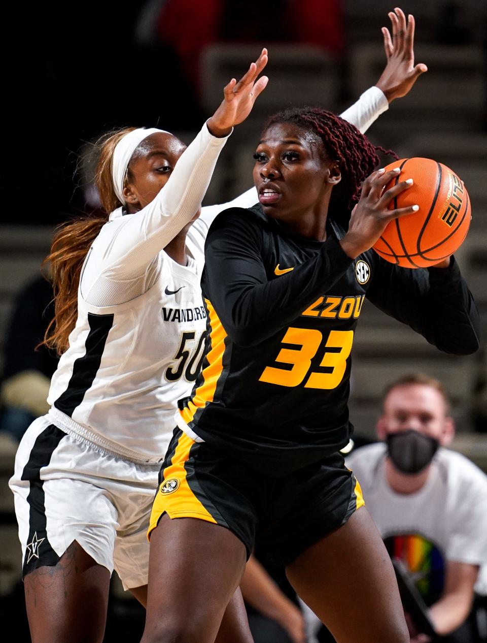 Missouri guard Aijha Blackwell (33) looks to pass past Vanderbilt forward Kaylon Smith (50) during the first quarter Thursday at Memorial Gym in Nashville, Tenn.