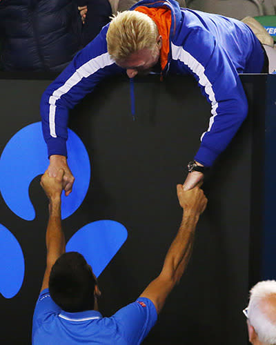 Djokovic and coach Boris Becker embrace.