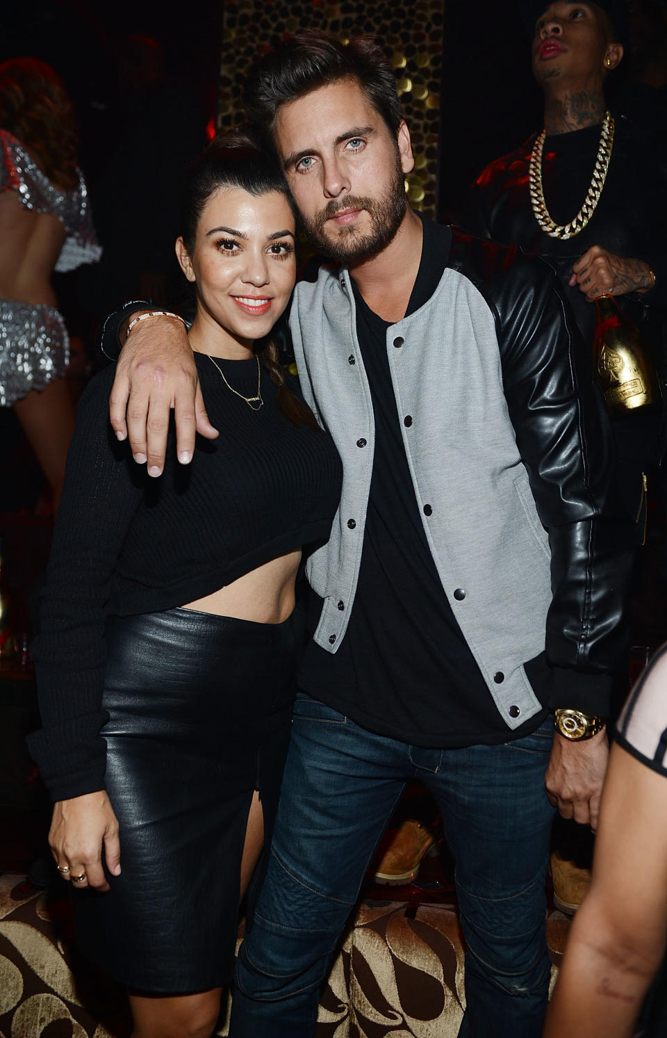 Kourtney Kardashian and Scott Disick pose at Kim Kardashian's 33rd birthday party on October 25, 2013