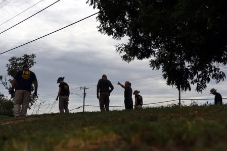 State troopers and other emergency personnel are seen following a shooting in Odessa