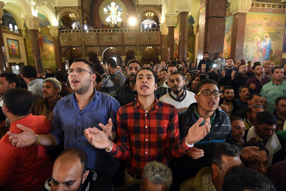 Men pray for the victims of the blast at the Coptic Christian Saint Mark's church in Alexandria the previous day during a funeral procession at the Monastery of Marmina in the city of Borg El-Arab, east of Alexandria, on April 10, 2017.