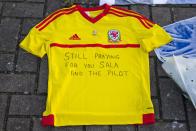 <p>A Wales shirt with a message for missing striker Sala (Getty Images) </p>