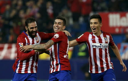 Football Soccer - Atletico Madrid v Rayo Vallecano - Spain King's Cup- Vicente Calderon stadium, Madrid, Spain - 14/1/16 Atletico Madrid's Angel Correa celebrates scoring with teammates Matias Kranevitter and Jesus Gamez. REUTERS/Susana Vera