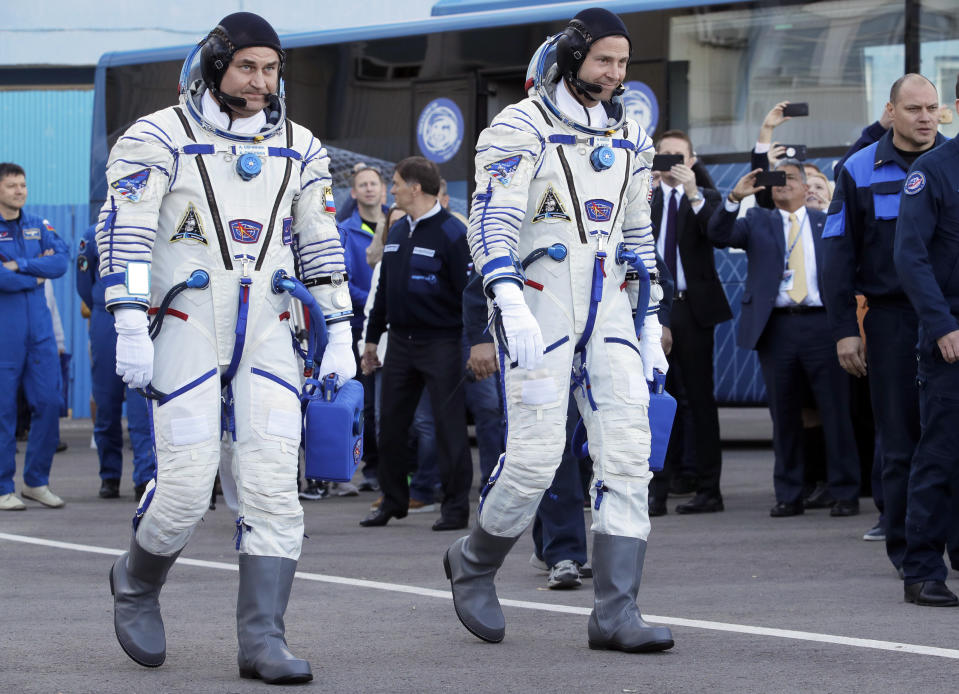 U.S. astronaut Nick Hague, right and Russian cosmonaut Alexey Ovchinin, member of the main crew of the expedition to the International Space Station (ISS), walk prior the launch of Soyuz MS-10 space ship at the Russian leased Baikonur cosmodrome, Kazakhstan, Thursday, Oct. 11, 2018. (AP Photo/Dmitri Lovetsky, Pool)