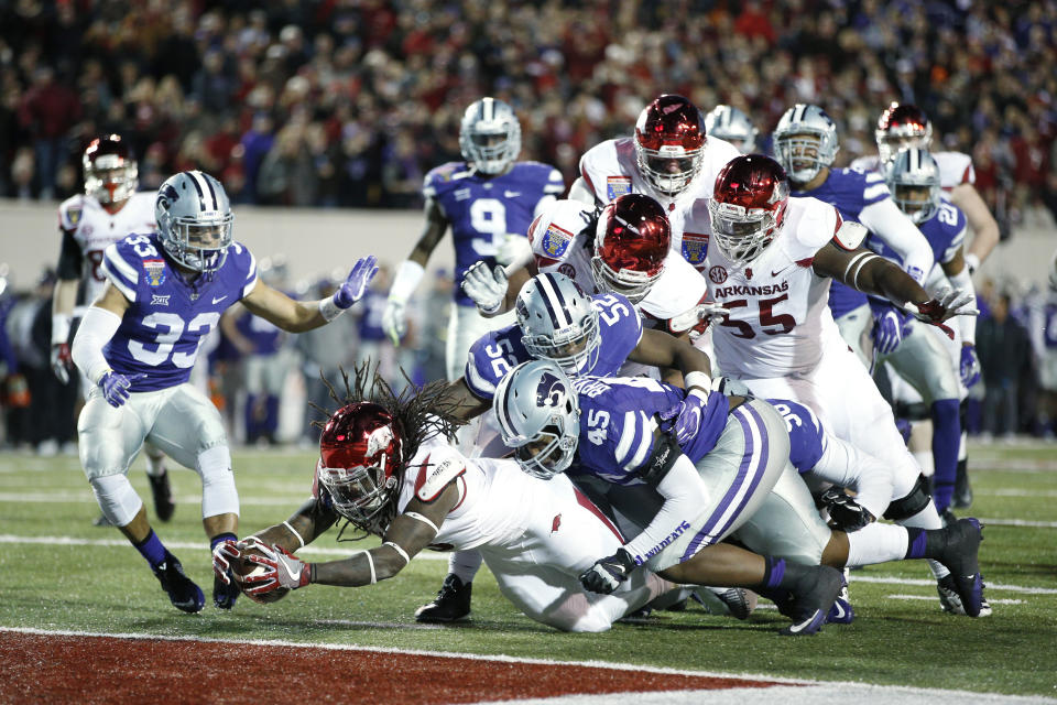 MEMPHIS, TN – JANUARY 2: Alex Collins #3 of the Arkansas Razorbacks carries a pile of defenders for a 14-yard touchdown run against the Kansas State Wildcats in the fourth quarter of the AutoZone Liberty Bowl at Liberty Bowl Memorial Stadium on January 2, 2016 in Memphis, Tennessee. (Photo by Joe Robbins/Getty Images)