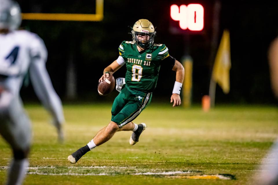 Savannah Country Day's Barry Kleinpeter scrambles to find an open receiver downfield against Stratford Academy at Saunders Field on Nov. 13.