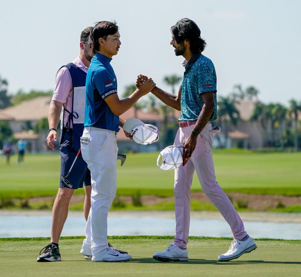 Akshay Bhatia and playing partner Min Woo Lee congratulate each other on the 18th green during the final round of the Honda Classic at PGA National Resort &amp; Spa on Sunday, February 26, 2023, in Palm Beach Gardens, FL.