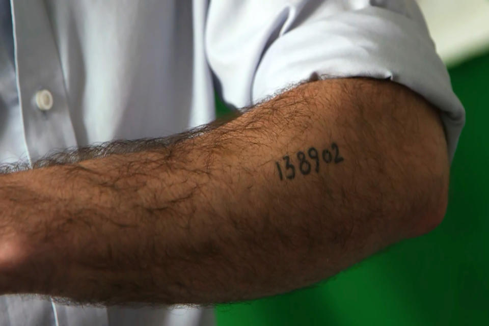 Lang shows his grandfather's Auschwitz ID number tattooed on his arm. (NBC News)