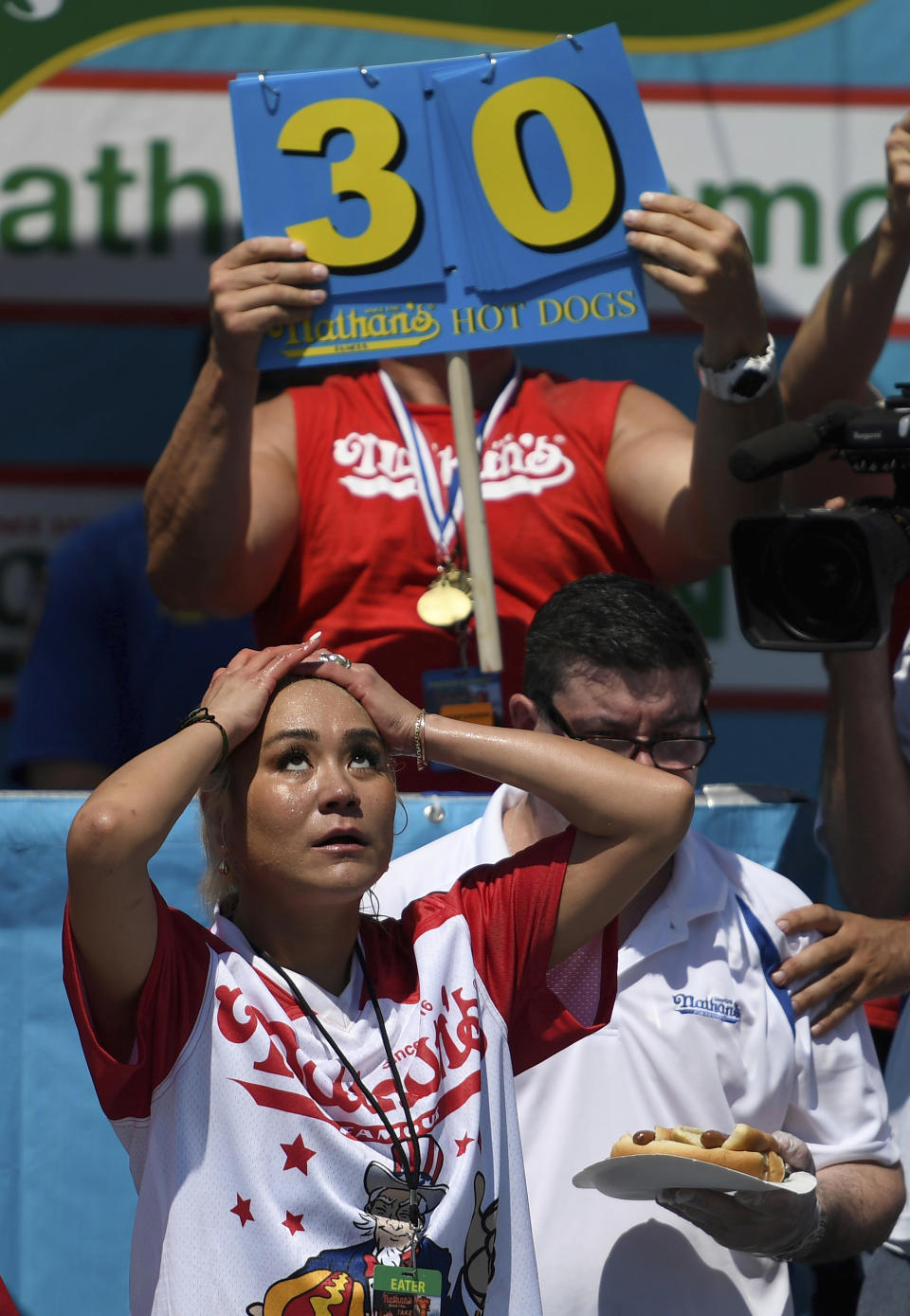 Miki Sudo reacts after the clock runs out in the women's competition of Nathan's Famous July Fourth hot dog eating contest, Thursday, July 4, 2019, in New York's Coney Island. (AP Photo/Sarah Stier)