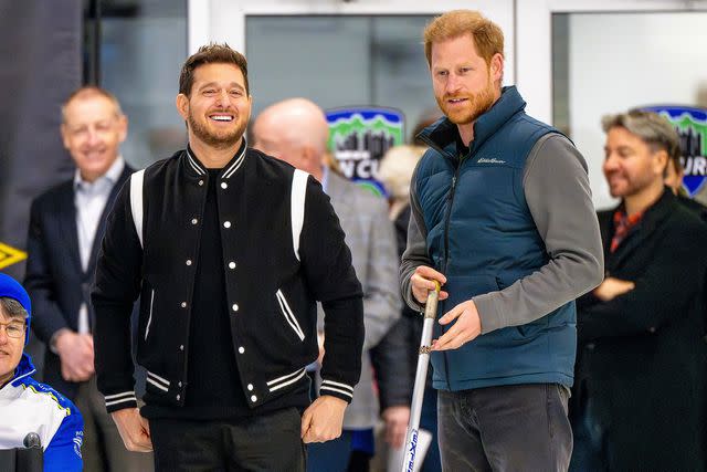 <p>Sipa via AP Images</p> Prince Harry and Michael Bublé smile together at the One Year to Go event before the Invictus Games Vancouver Whistler 2025