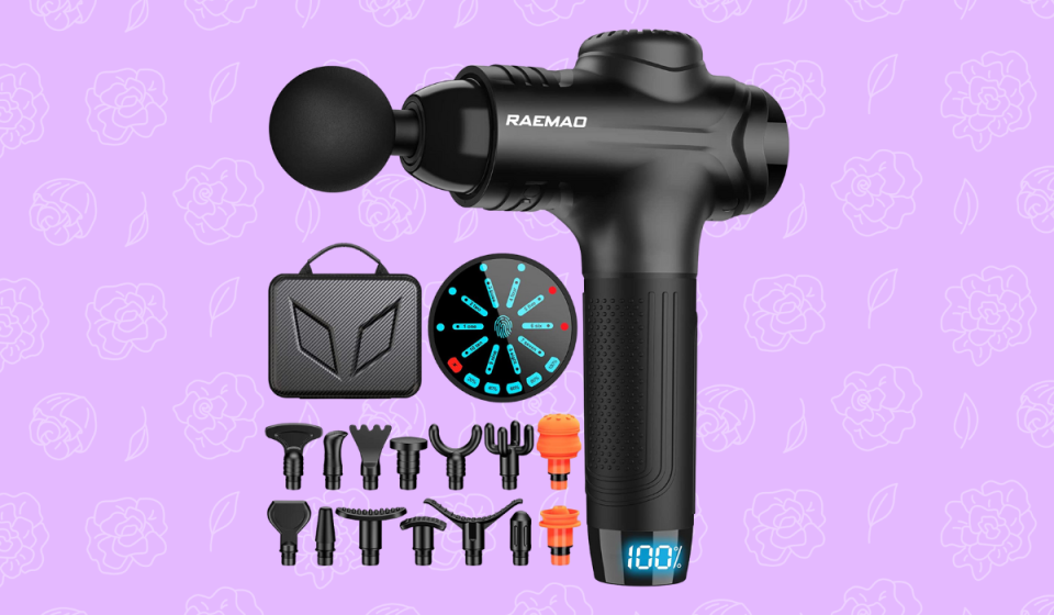 Black massage gun with various attachments.